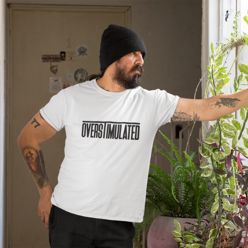 Person wearing the Overstimulated Tee, showcasing its relaxed fit and empowering slogan, perfect for homeschooling parents.